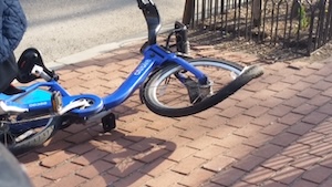 mangled bike after a collision with underinsured vehicle